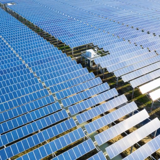 arrays of blue solar panels on photovoltaic power station, aerial view of new energy