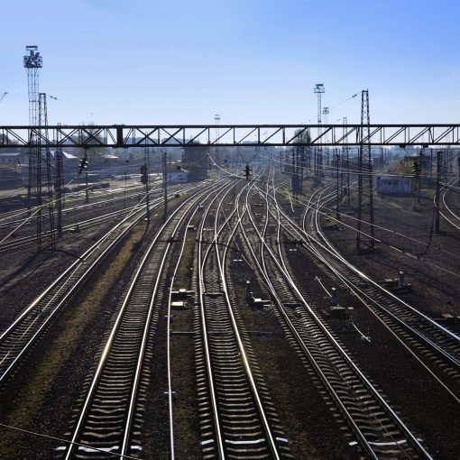 Railway landscape. Empty railway tracks in depot under the open air when the morning light